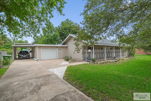 single story home featuring a carport, a porch, a garage, and a front yard