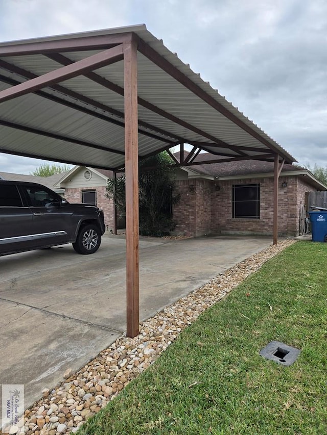 view of parking featuring a carport and a lawn