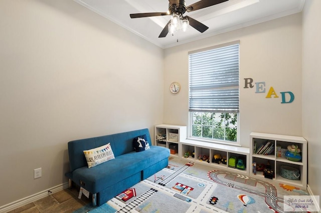 sitting room with ceiling fan and ornamental molding