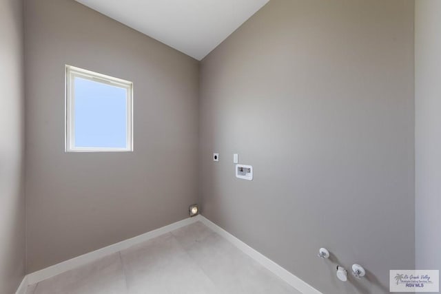 laundry area with tile patterned floors, hookup for an electric dryer, hookup for a gas dryer, and hookup for a washing machine