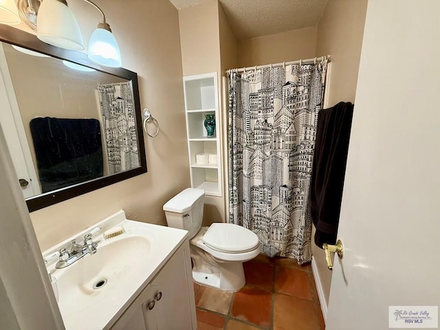 bathroom featuring vanity, a textured ceiling, and toilet