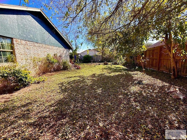view of yard with fence