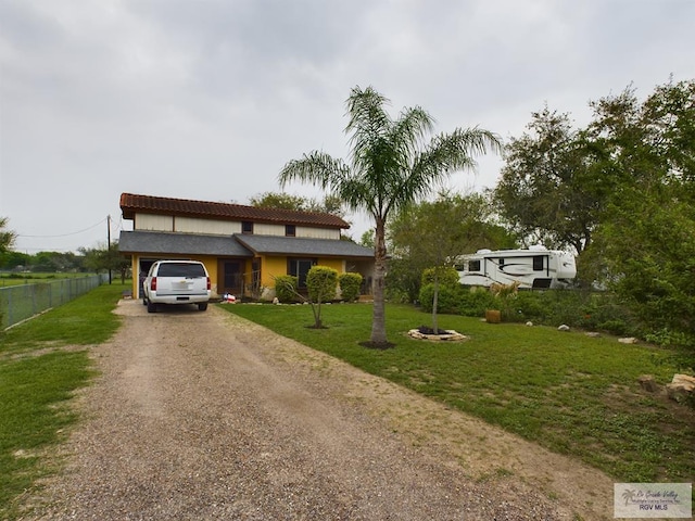 view of front of home featuring a garage and a front yard