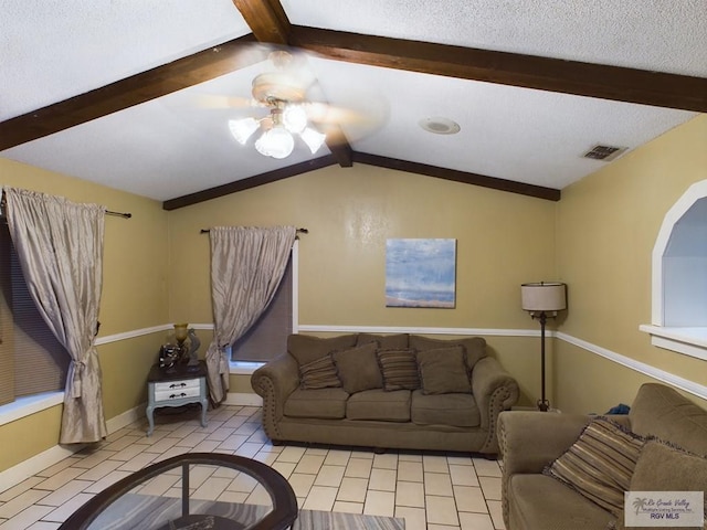 tiled living room featuring vaulted ceiling with beams and ceiling fan