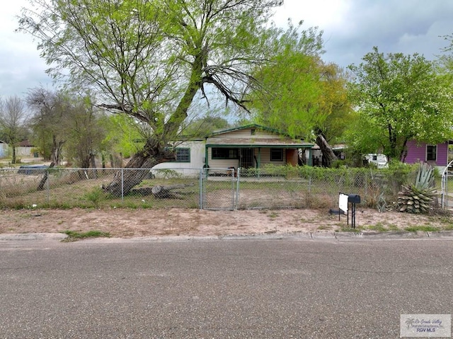 bungalow-style house with a fenced front yard