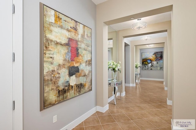 hall with light tile patterned flooring