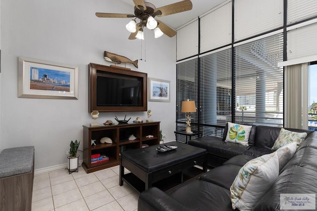 tiled living room featuring ceiling fan