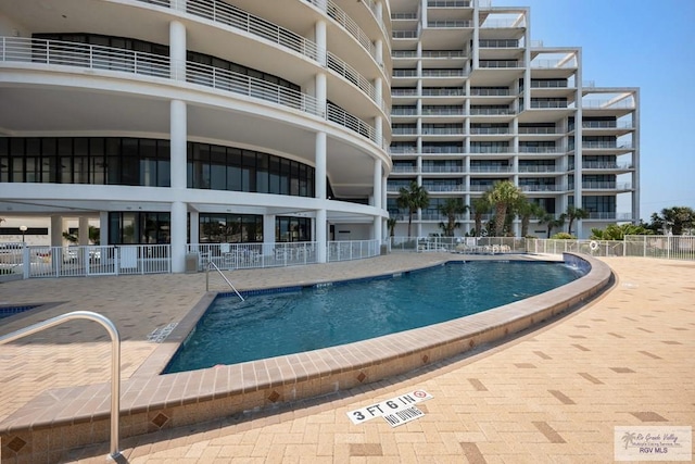 view of swimming pool featuring a patio area