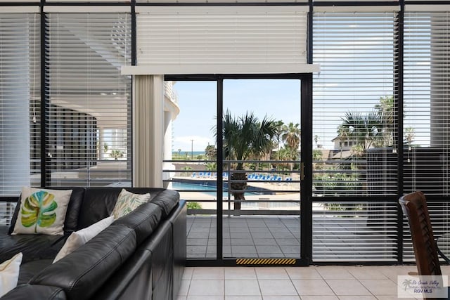 doorway to outside featuring tile patterned floors