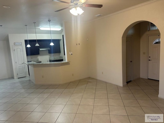 unfurnished living room featuring visible vents, a ceiling fan, ornamental molding, light tile patterned flooring, and arched walkways
