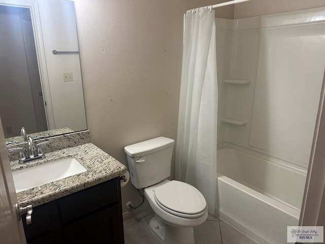 full bath featuring shower / bath combo with shower curtain, vanity, tile patterned flooring, and toilet