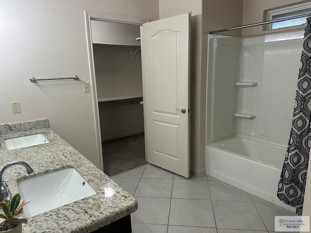 bathroom featuring double vanity, tile patterned flooring, shower / tub combo with curtain, and a sink