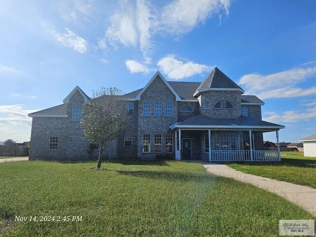 27406 Kelly Ct, La Feria, TX 78559 - view of front facade featuring a front lawn and a porch