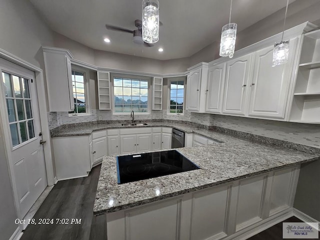 kitchen featuring open shelves, black electric stovetop, white cabinetry, a sink, and recessed lighting
