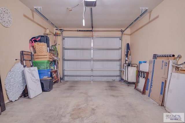 garage featuring a garage door opener