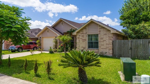 ranch-style house with a garage, concrete driveway, fence, a front lawn, and brick siding