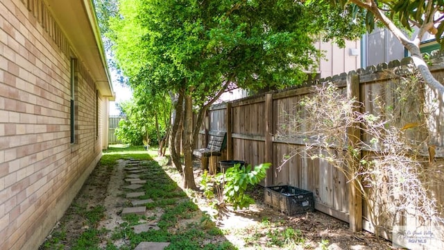 view of yard with a fenced backyard