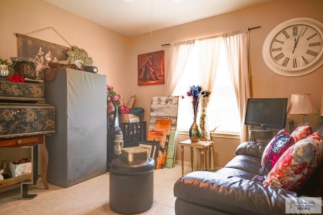 living room featuring tile patterned flooring and a healthy amount of sunlight