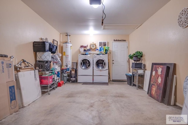 garage with washing machine and dryer, gas water heater, and a garage door opener