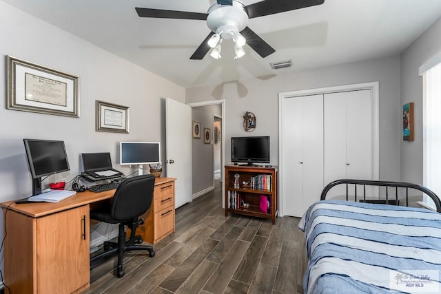 1916 Loquat Dr, Harlingen, TX 78552 - bedroom featuring an office area, dark wood finished floors, a closet, ceiling fan, and baseboards