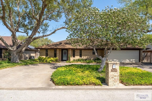 1916 Loquat Dr, Harlingen, TX 78552 - view of front of home featuring driveway and an attached garage