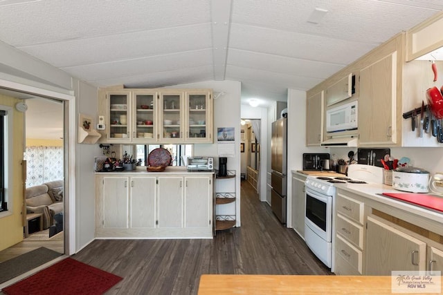 kitchen with dark wood finished floors, light countertops, glass insert cabinets, vaulted ceiling, and white appliances