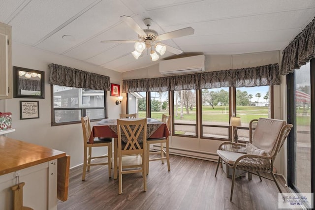 dining room featuring lofted ceiling, a sunroom, a wall mounted air conditioner, and wood finished floors