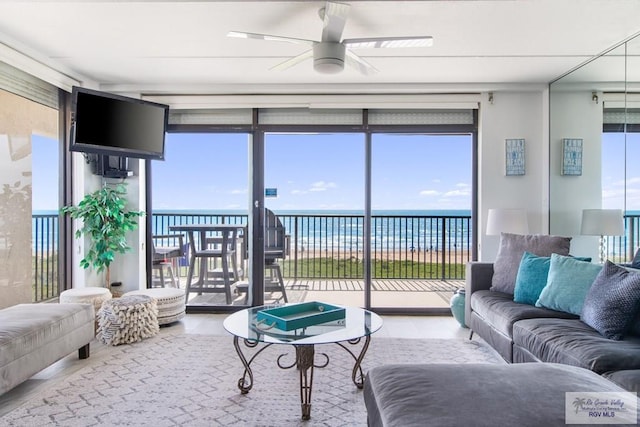 3000 Gulf Blvd, South Padre Island, TX 78597 - living area with a ceiling fan and floor to ceiling windows