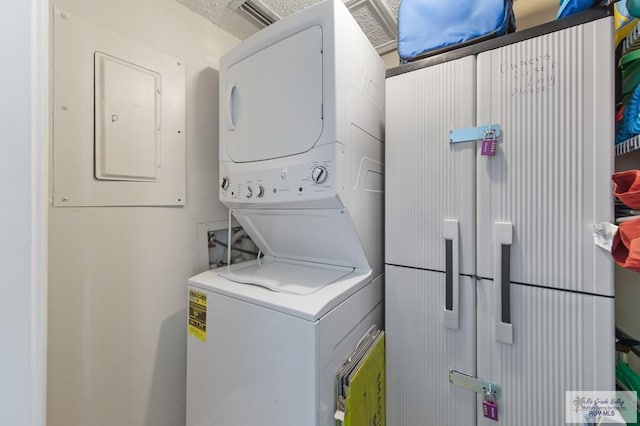 3000 Gulf Blvd, South Padre Island, TX 78597 - laundry room with estacked washer and dryer and electric panel