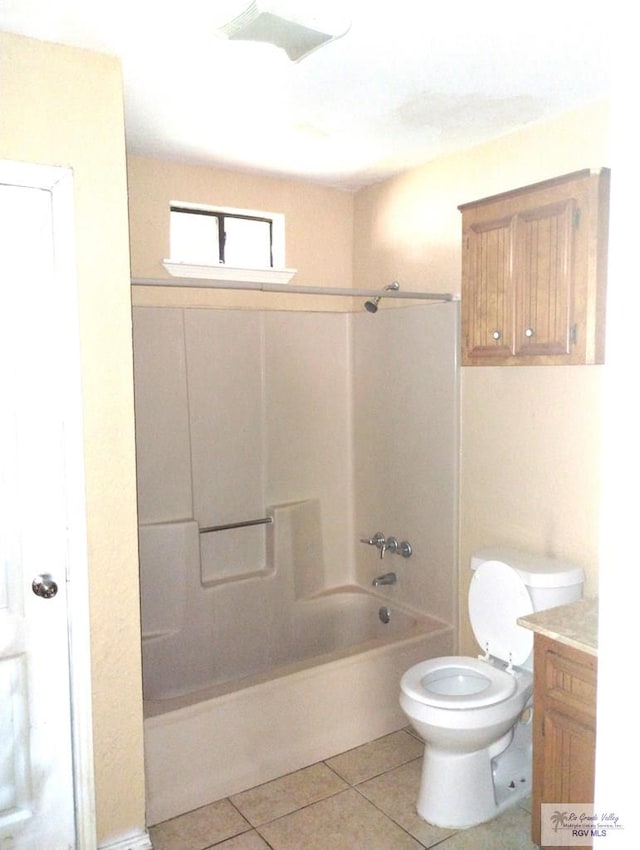 full bathroom featuring vanity, tile patterned flooring, toilet, and tub / shower combination