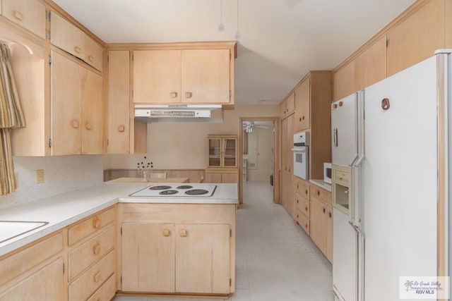 kitchen with ceiling fan, white appliances, and light brown cabinetry