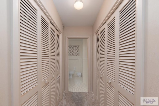 hallway with light tile patterned floors