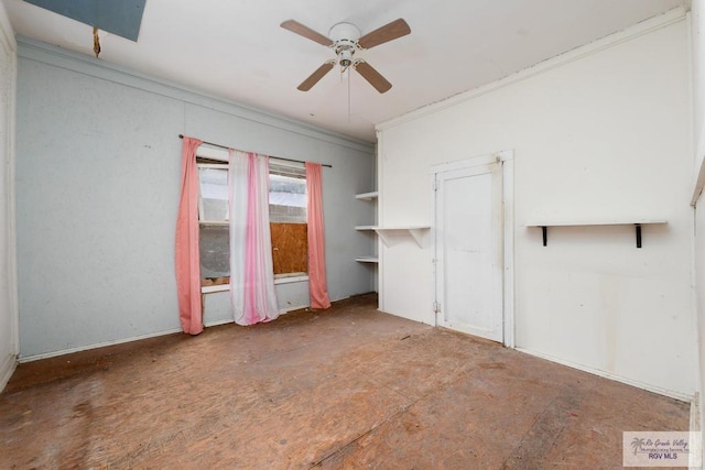 empty room with ceiling fan and ornamental molding