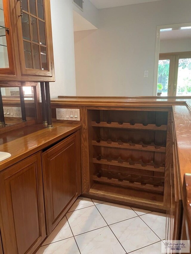 bar with light tile patterned floors