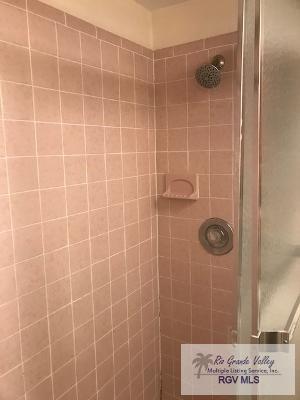 bathroom with a tile shower