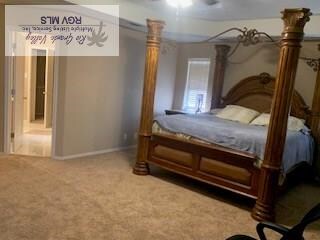 bedroom featuring carpet floors, baseboards, and a ceiling fan