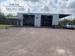 view of building exterior with a detached garage