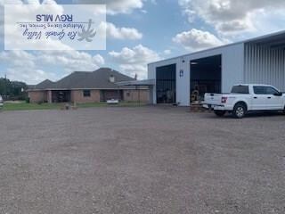 view of parking / parking lot with a detached garage