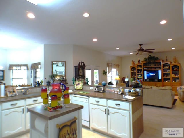 3319 Country Club Dr, Edinburg, TX 78542 - kitchen featuring open floor plan, a center island, recessed lighting, white cabinets, and ceiling fan