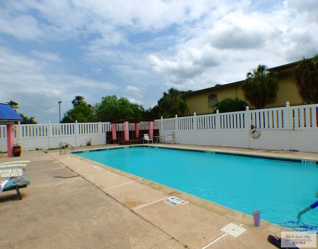3319 Country Club Dr, Edinburg, TX 78542 - community pool featuring a patio area