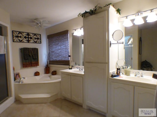 3319 Country Club Dr, Edinburg, TX 78542 - full bath featuring a bath, tile patterned flooring, two vanities, and a ceiling fan