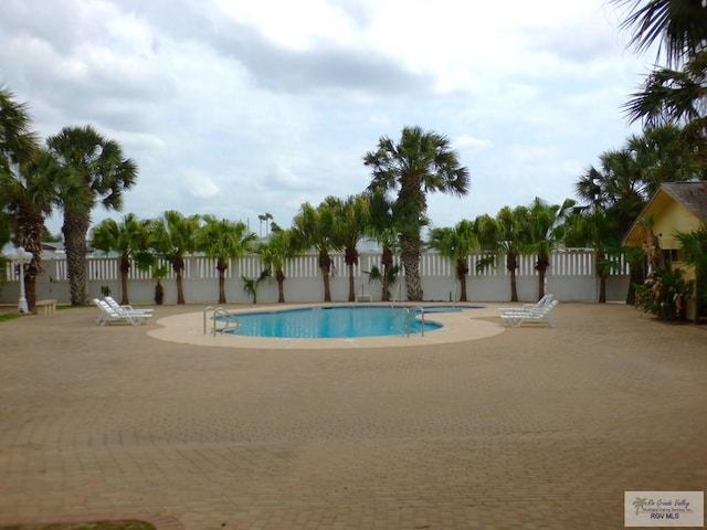 3319 Country Club Dr, Edinburg, TX 78542 - community pool featuring a patio