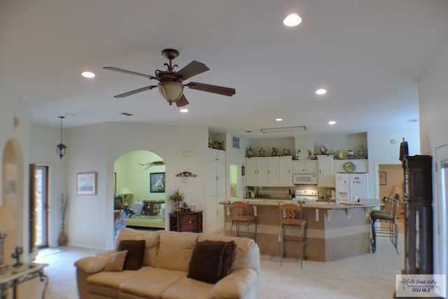 3319 Country Club Dr, Edinburg, TX 78542 - living area with arched walkways, ceiling fan, and recessed lighting