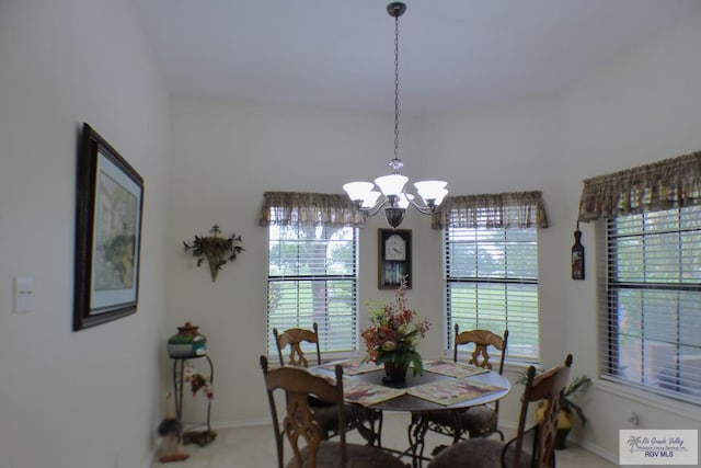3319 Country Club Dr, Edinburg, TX 78542 - dining area with plenty of natural light, a chandelier, baseboards, and carpet floors