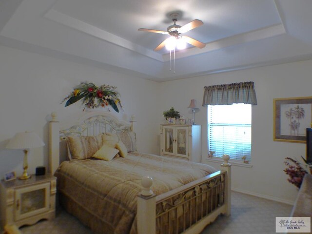 3319 Country Club Dr, Edinburg, TX 78542 - bedroom with a raised ceiling, light colored carpet, baseboards, and a ceiling fan