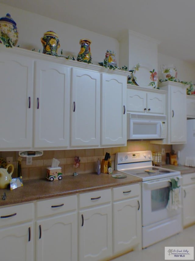 3319 Country Club Dr, Edinburg, TX 78542 - kitchen featuring white appliances, white cabinets, and tasteful backsplash