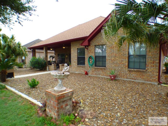 3319 Country Club Dr, Edinburg, TX 78542 - view of front of property with brick siding and a shingled roof