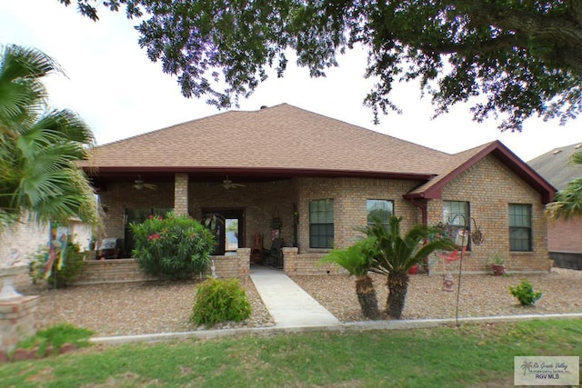 3319 Country Club Dr, Edinburg, TX 78542 - rear view of house with a ceiling fan, brick siding, and a shingled roof