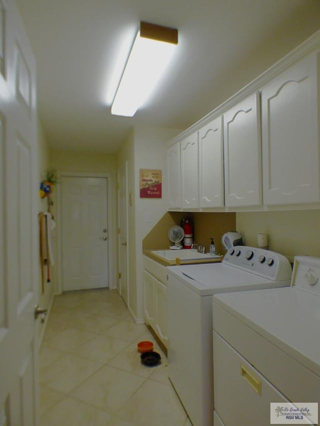 3319 Country Club Dr, Edinburg, TX 78542 - laundry area with cabinet space, washing machine and dryer, light tile patterned floors, and baseboards