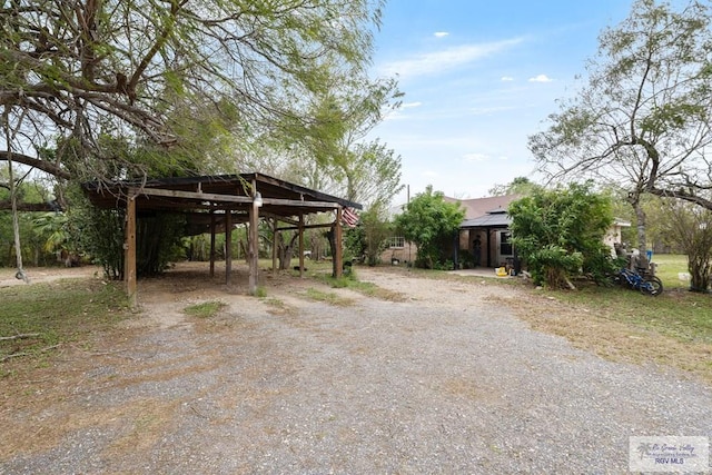 exterior space featuring a carport